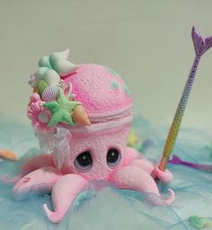 an octopus with a hat on its head and a toothbrush in it's mouth