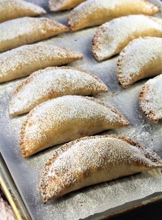 some food is laying out on a baking sheet and ready to be baked in the oven