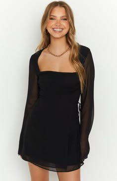 Black Long Sleeve Mini Dress

 How to style:

 This cute Black Long Sleeve Mini Dress () is perfect for cocktails and a night out with the girls. Easily pair it with a pair of strappy heels () and gold jewellery () to be the 'it girl' of your next event.

 Features:

   
 * Light weight material
 
 * Long Sleeves
 
 * Square neckline
 
 * Wrap skirt with an adjustable tie on the left of the bodice
 
 * Mini Length
 
 * Sheer material
 
 * Body lined, arms unlined
 
 *  Invisible zip on the back Sleek Square Neck Mini Dress For Party, Sleek Mini Dress With Square Neck For Party, Sleek Square Neck Mini Dress For Date Night, Glamorous Square Neck Mini Dress For Date Night, Sleek Mini Dress With Square Neck For Date Night, Sleek Square Neck Party Dress, Trendy Square Neck Mini Dress For Evening, Glamorous Square Neck Mini Dress For Night Out, Flirty Mini Dress With Square Neck For Party