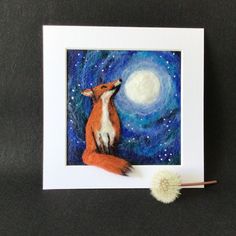 a painting of a red fox sitting on top of a table next to a brush