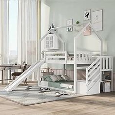 a white bunk bed with a slide in the middle