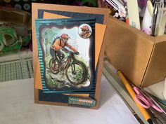 a card with an image of a man riding a bike