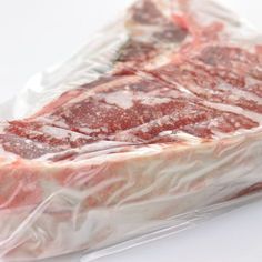 a piece of raw meat wrapped in plastic