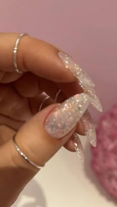 Sparkly Oval Acrylic Nails, Natural Nails Acrylic With Glitter, Soft Glitter Nails Acrylic, Clear Glitter Acrylic Nails Almond, Nail With Accessories, Clear Nails Sparkle, Simple Glitter Almond Nails, Long Almond Glitter Nails, Glitter Nail Inspo Sparkle