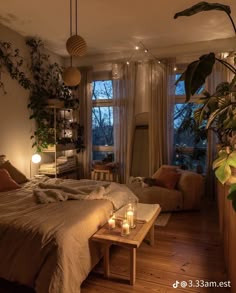 a bed room with a neatly made bed and two candles on the coffee table next to it