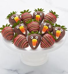 chocolate covered strawberries decorated like turkeys with strawberries in the shape of birds