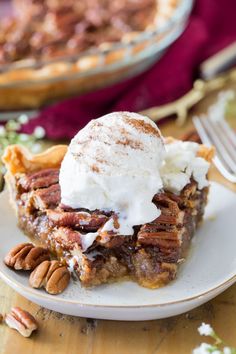 a slice of pecan pie with whipped cream on top