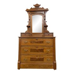 an antique wooden dresser with mirror on top