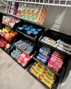 a grocery store filled with lots of different types of food and snacks on shelves next to each other