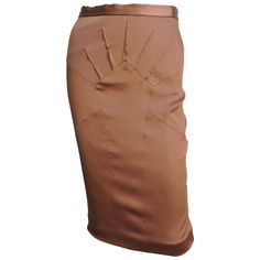 A beautiful copper brown stretch silk pencil skirt from Dolce & Gabbana. It has a waist band plus fabulous seaming and darts radiating from a center front panel. It is lined in same fabric, has a back kick pleat at the hem and a center back zipper. New with tags. Fits sizes Small, Medium. Marked Italian size 42. Waist 27" Hips 36-38" Length 24" African Ankara Dresses, Silk Pencil Skirt, Silk Dressing Gown, Ivory Skirt, Much Style, Gown Skirt, Gold Lame, Ankara Dresses, Copper Brown