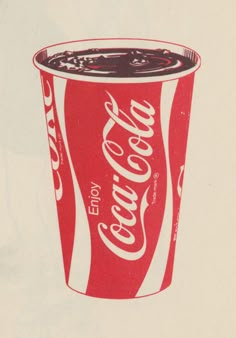 a red and white cup filled with coca - cola on top of a white background