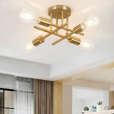 a modern style ceiling light with four lights