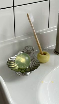 a toothbrush holder sitting on top of a bathroom sink