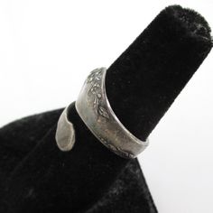 "An attractive vintage marked \"ONEIDA COMMUNITY\" silver tone spoon ring with simple floral design. I haven't polished it in any way so it has a very very dark patina. It currently fits me like about a size 7 3/4 but you could bend it slightly to adjust the size. Please check out my store with similar things added almost daily. Remember, shipping for additional items is always free." Vintage Style Engraved Toe Ring, Vintage Adjustable Engraved Nickel-free Ring, Adjustable Vintage Engraved Nickel-free Ring, Vintage Adjustable Nickel-free Engraved Ring, Adjustable Nickel-free Vintage Engraved Ring, Vintage Engraved Toe Ring, Vintage Adjustable Engraved Etched Ring, Vintage Adjustable Engraved Ring, Vintage Stamped Engraved Open Ring