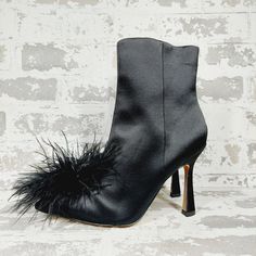 New A Poof Of Feathers Tops Chic Pointed Toes And Stiletto Heels For A Striking Accent In The Ultra-Sleek Ency Booties From Sam Edelman. 3-3/4" Stiletto Heel Pointed-Toe Booties With Inner Ankle Zipper Closure Feather Pom Pom And Embellishments At Upper Cushioned Insole For Added Comfort Fabric Upper; Manmade Lining; Rubber Sole Imported Formal Pointed Toe Heels With Feathers, Elegant Pointed Toe Heels With Feather Trim, Formal Ankle Strap Heels With Feather Trim, Evening Heels With Feather Trim, Pointed Toe, Feather Heels, Black Party Booties With 4-inch Heel, Dress Booties, Feather Tops, Sam Edelman Shoes