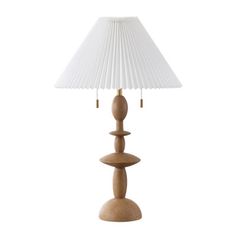 a wooden table lamp with a white shade