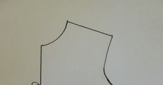 a drawing of a dress on a white wall with a black marker in the middle