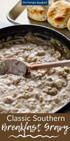 a pan filled with food next to some biscuits and bread on a table in front of the words classic southern breakfast gravy