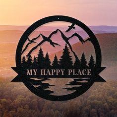 the logo for my happy place is shown in front of some mountains and trees at sunset