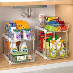 two clear shelves with cleaning products and toiletries on them in a bathroom under a faucet