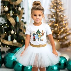 Celebrate Christmas in style with our adorable Nutcracker shirt. This fun shirt comes in a sweatshirt or t-shirt and is perfect for your little one's Christmas and winter festivities. Get your little one ready for the holiday with this eye-catching graphic tee! 🌟 Product Details: Design: Colorful ballerinas, presents, mouse knight, nutcracker, Christmas tree, and presents Style: Unisex short-sleeve t-shirt or crewneck sweatshirt Sizes available: 2T-5T & YS-Y2XL (Please refer to the size chart f Toddler Christmas Sweatshirt, Mouse Knight, Christmas Tree And Presents, Nutcracker Shirt, Nutcracker Christmas Tree, Holiday Graphic Tees, Toddler Size Chart, Christmas Tee Shirts, Kids Christmas Outfits