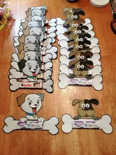 the dogs are lined up in rows on the floor with their name tags attached to them