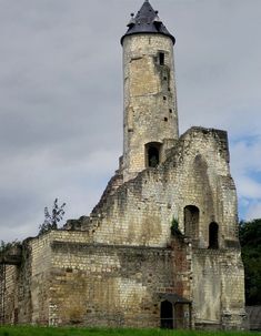 an old stone building with a clock tower