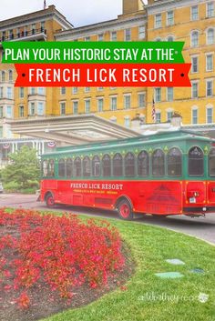 a red and green bus driving down a street next to tall buildings with the words plan your historic stay at the french lick resort