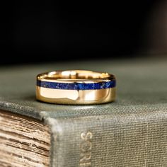 a close up of a ring on top of a book