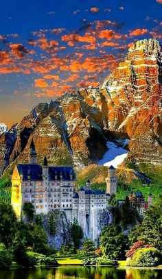 a castle in the middle of a lake with mountains in the background and colorful clouds