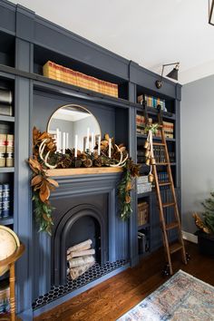 a living room filled with furniture and a fire place next to a fireplace covered in christmas decorations