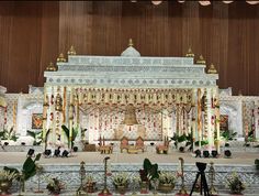 an elaborate stage set up for a wedding ceremony