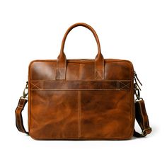 Elevate your professional presence with our Bison Elite Briefcase, meticulously crafted for a stylish edge. Fashioned from the finest full-grain buffalo leather, this masterpiece offers exceptional durability and a unique texture. Designed with capacious compartments and organizational elements, it seamlessly combines practicality with opulence. Its rich brown tone, complemented by striking orange accents, exudes undeniable sophistication, making it a perfect addition to any ensemble. Embrace th Brown Tone, Leather Office, Orange Accents, Buffalo Leather, Leather Briefcase, Buffalo, Grain, Adjustable Straps, Texture