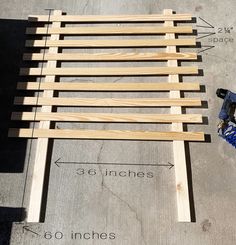 a bench made out of wooden slats with measurements