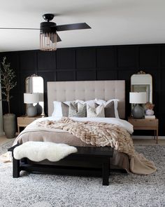 a bedroom with black walls and white carpet