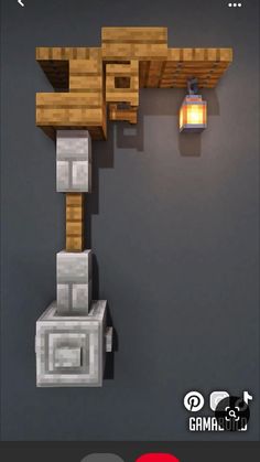 a lamp that is on the side of a wall next to some rocks and bricks