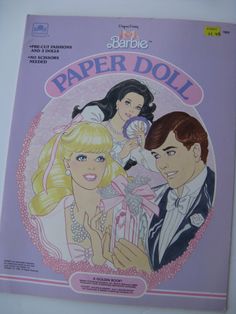 the barbie paper doll book is opened to show an image of two women and a man