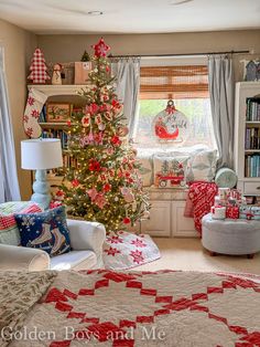 a christmas tree in the corner of a living room decorated with red and white decorations