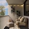 a living room filled with furniture on top of a balcony