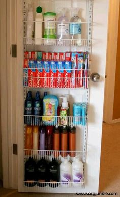 an organized pantry with toiletries and hand sanitizers on the door sill