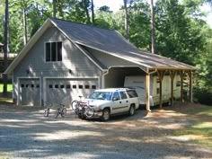 a car is parked in front of a garage