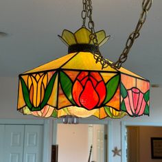 a stained glass lamp hanging from the ceiling