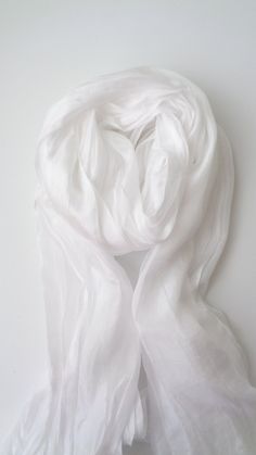 White silk scarf, silk scarf hand dyed White silk scarf mens women silk scarf elegant White scarf 100% natural silk, unhemmed edges. It is a stylish accessory for any outfit. This is a single scarf size (90 cm * 200 cm) (78.74 inches * 35.43 inches). This white silk scarf is an accessory for an outfit of the day, or a gift for yourself or your loved ones. I hand dyed this silk scarf with great attention. Material: silk Made to order. care Instructions hand wash, use the softener of your choice, White Silk Scarf, Unique Scarf, White Scarf, White Scarves, Scarf Silk, Natural Silk, White Silk, Silk Scarves, Stylish Accessories