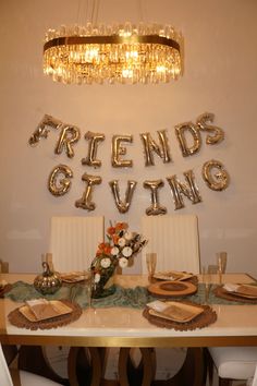 a dining room table with plates and place settings