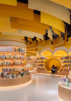 the interior of a book store filled with lots of books and shelves full of books