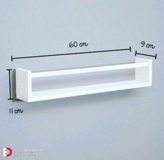 a wooden shelf mounted on the wall with measurements