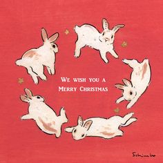 a group of rabbits sitting in a circle with the words we wish you a merry christmas