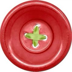 a red bowl with a green flower on it