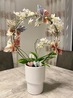 an arrangement of flowers in a vase on a table