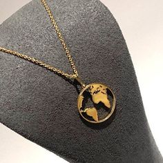 Beautiful quality, highest grade materials used,  smooth gold Globe Pendant & Necklace. Hallmarked Gold on 925 Sterling Silver. We've soldered every single section of this chain and pendant to add to its longevity and security. It has an adjustable chain which makes its totally versatile suitable for layering up with other necklaces.  A perfect gift for those loved ones that are some distance away. Metal: Gold Plated on 925 Sterling Silver ( hallmarked ) Design: World / Globe, smooth, shiny. Length of Chain: 16 - 18 inch adjustable strong beautiful chain  Pendant: Approximately 15mm length & width  Assurance: We accept returns. Good To Know: We also create this exact necklace in Silver please view our shop under the necklace section.  Don't forget to hit 'favourite' on the right so it rema Luxury Stainless Steel Yellow Gold Necklaces, Luxury Gold Stainless Steel Necklace, Luxury Yellow Gold Stainless Steel Necklace, Luxury Stainless Steel Yellow Gold Necklace, Classic Gold Nickel-free Necklace, Matte Gold Jewelry Gift, Gold Polished Stainless Steel Necklace, Yellow Gold Polished Stainless Steel Necklace, Gold Stainless Steel Jewelry With Polished Finish